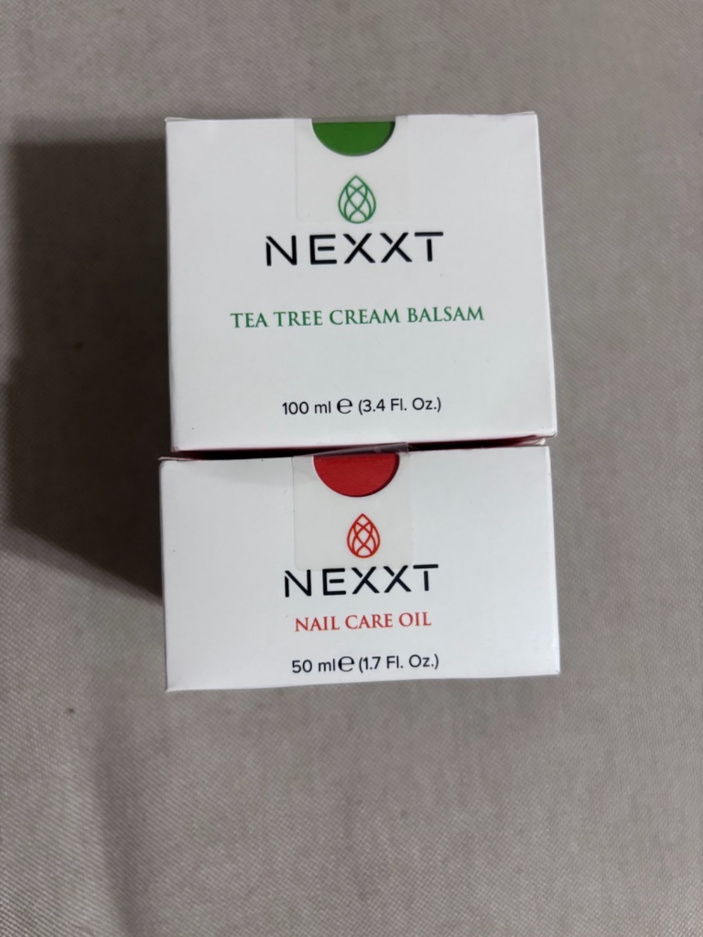 next Tea Tree Cream Balsam & Nail Care Oil Set - White with Green & Red Accents